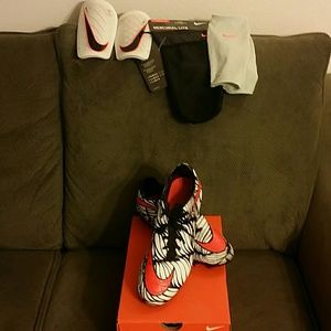 Men's soccer cleats and shin guards